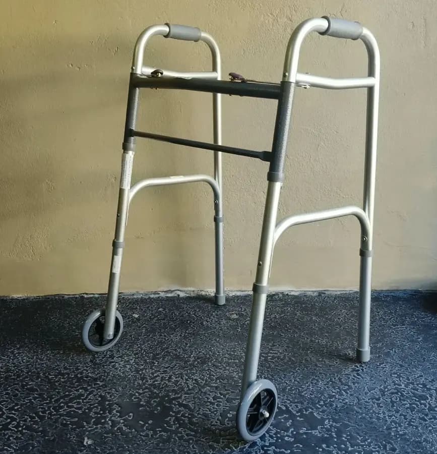 A folding walking frame with two front wheels